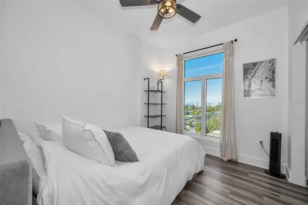 a view of a room with wooden floor and gym equipment
