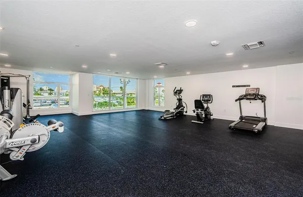 a view of a terrace with lawn chairs