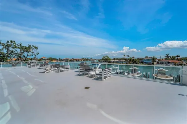 a swimming pool with outdoor seating and yard
