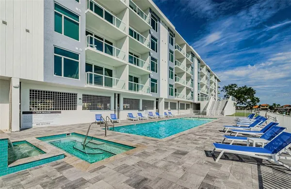 an aerial view of a house with a lake view