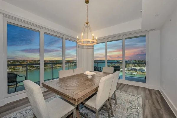 a terrace with outdoor seating and lake view