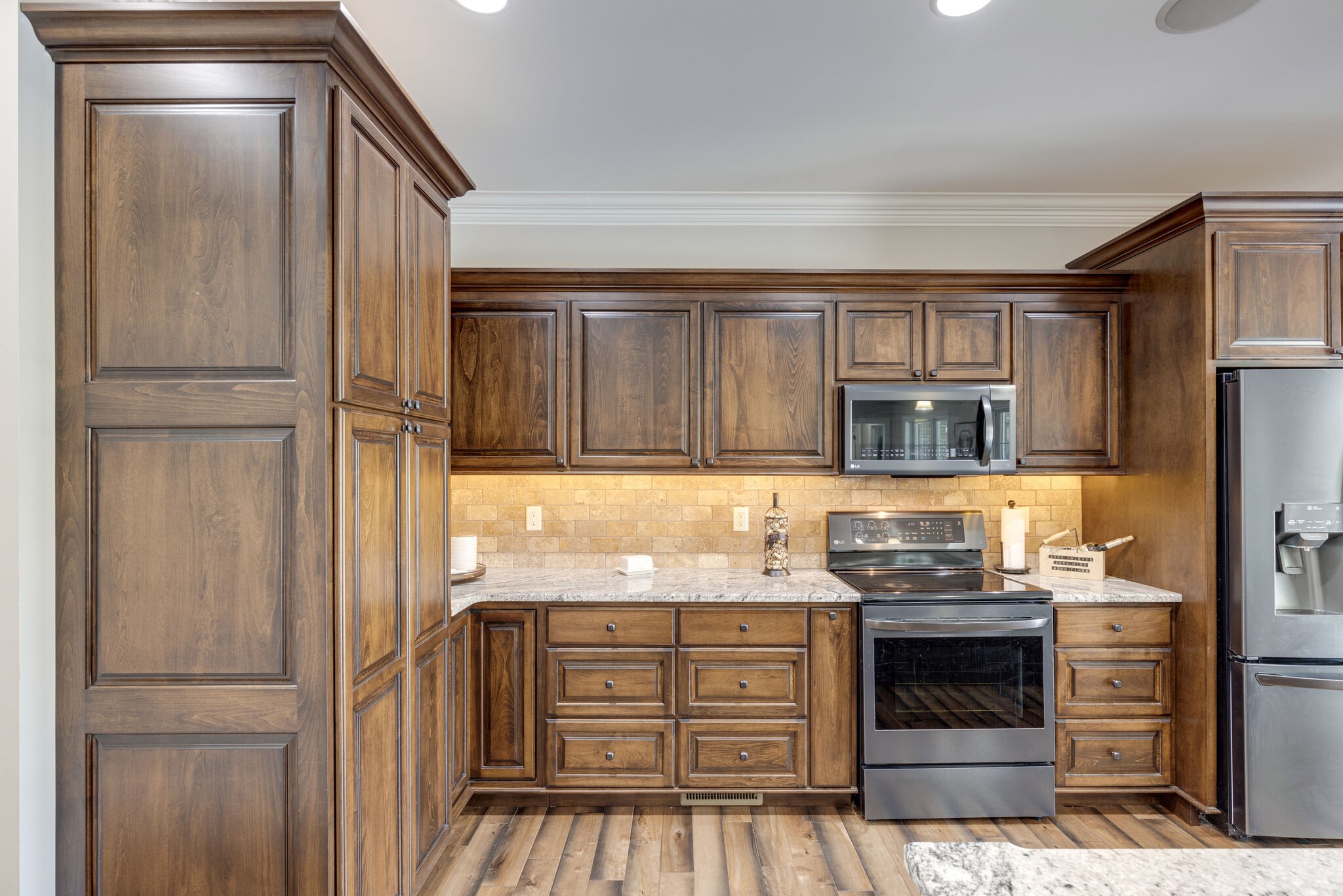 3165 Les Chappell Road Spring Hill, TN 37174 - Photo 14 of 70 a kitchen with stainless steel appliances granite countertop a refrigerator and a stove top oven