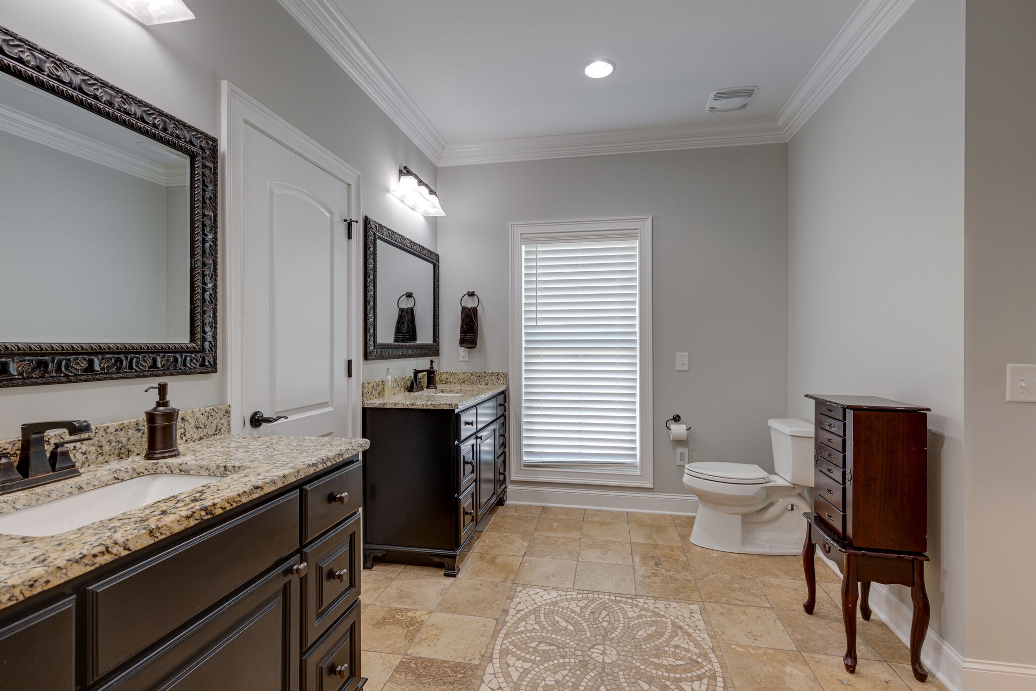 3165 Les Chappell Road Spring Hill, TN 37174 - Photo 25 of 70 a spacious bathroom with a granite countertop toilet a sink and a mirror