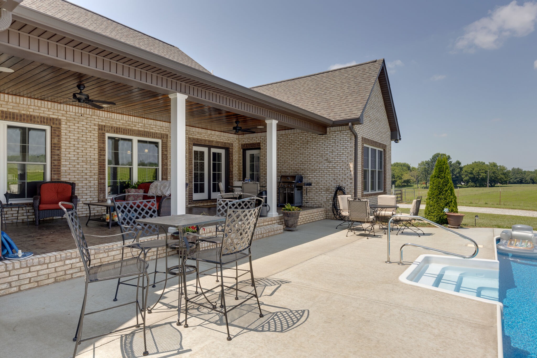 3165 Les Chappell Road Spring Hill, TN 37174 - Photo 34 of 70 a view of a patio with table and chairs potted plants and a large tree