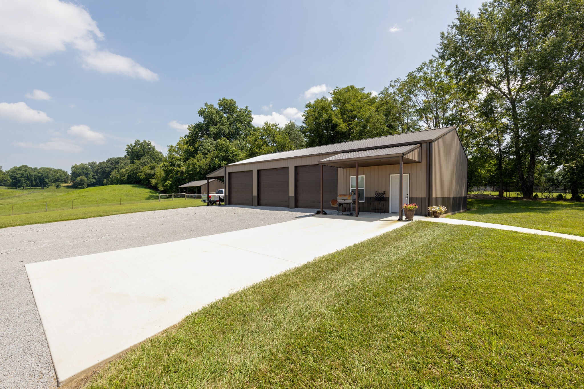 3165 Les Chappell Road Spring Hill, TN 37174 - Photo 39 of 70 a house view with swimming pool and trees in the background