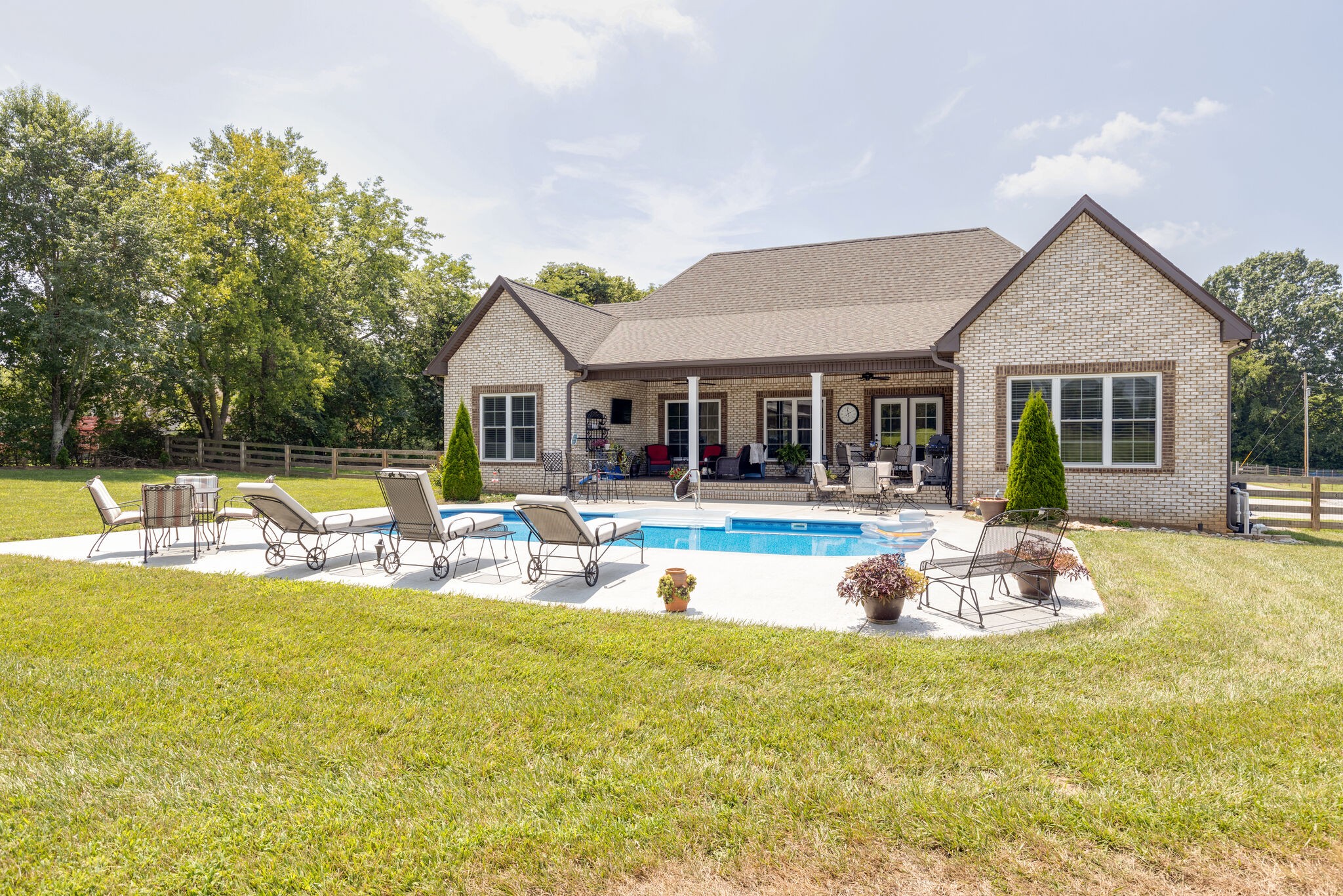 3165 Les Chappell Road Spring Hill, TN 37174 - Photo 49 of 70 a view of a house with a swimming pool and a chairs