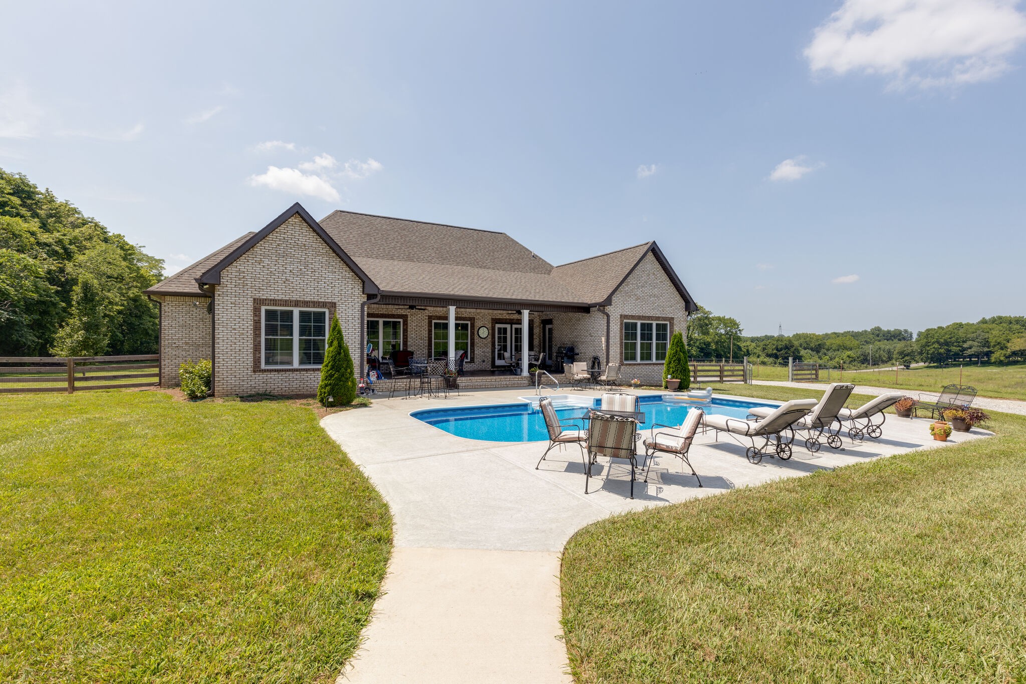 3165 Les Chappell Road Spring Hill, TN 37174 - Photo 50 of 70 a view of a house with swimming pool and sitting area