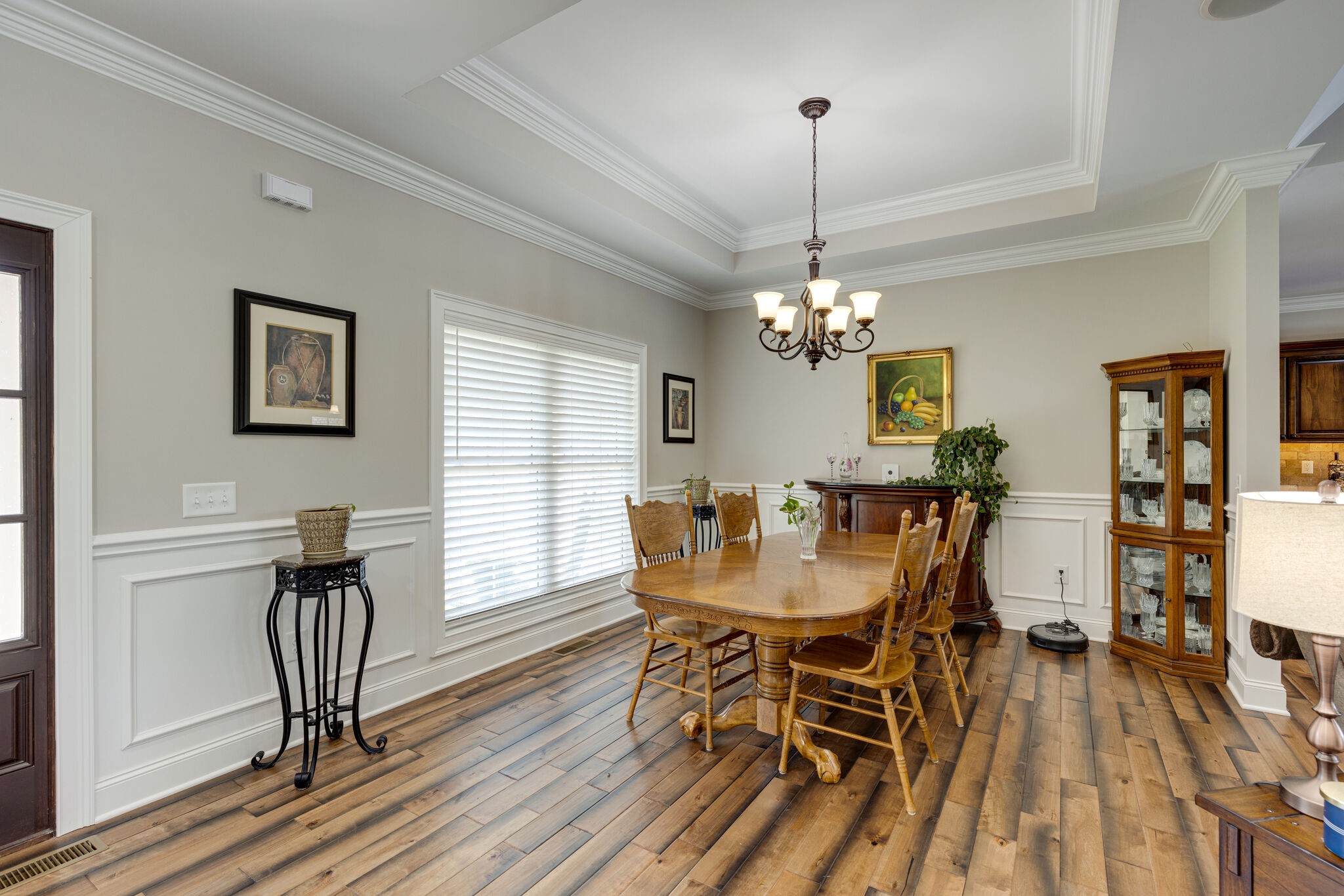 3165 Les Chappell Road Spring Hill, TN 37174 - Photo 5 of 70 a dining room with furniture a chandelier and wooden floor