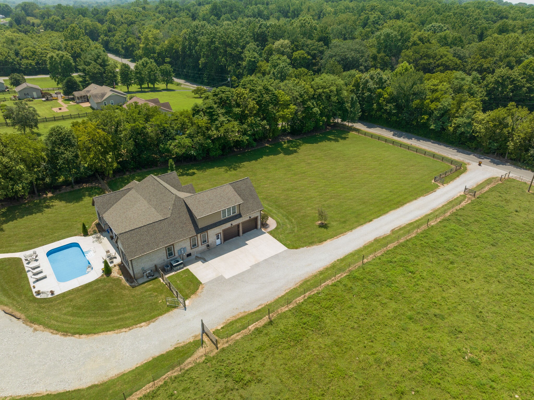 3165 Les Chappell Road Spring Hill, TN 37174 - Photo 58 of 70 an aerial view of a house with swimming pool and lake view