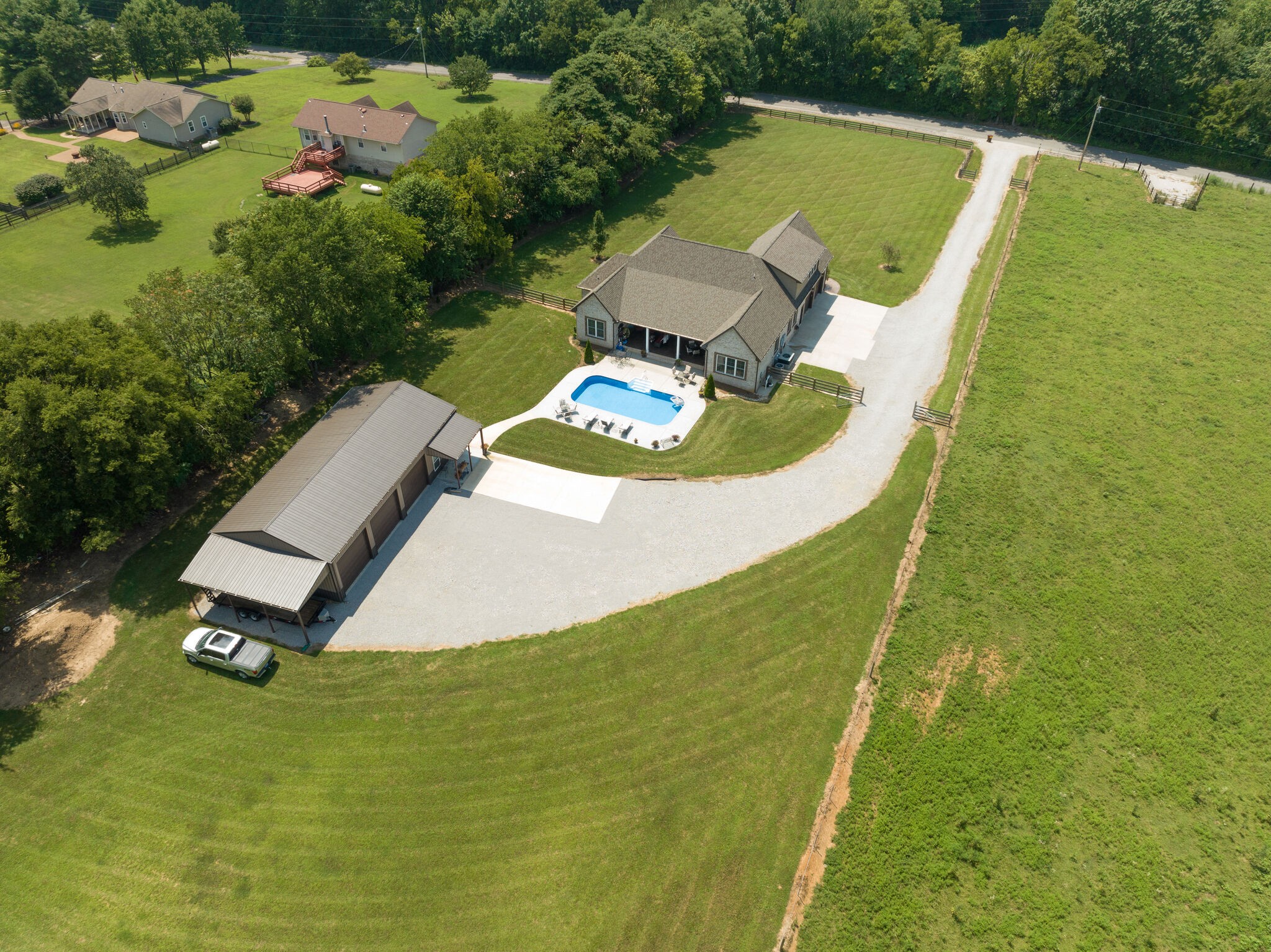 3165 Les Chappell Road Spring Hill, TN 37174 - Photo 64 of 70 a view of a swimming pool with a yard