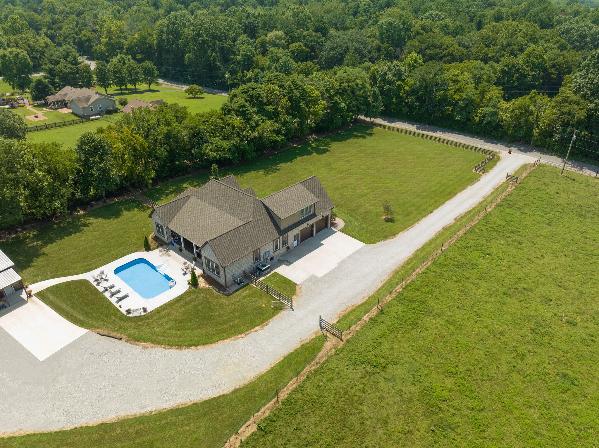 3165 Les Chappell Road Spring Hill, TN 37174 - Photo 65 of 70 an aerial view of a house with outdoor space swimming pool and lake view