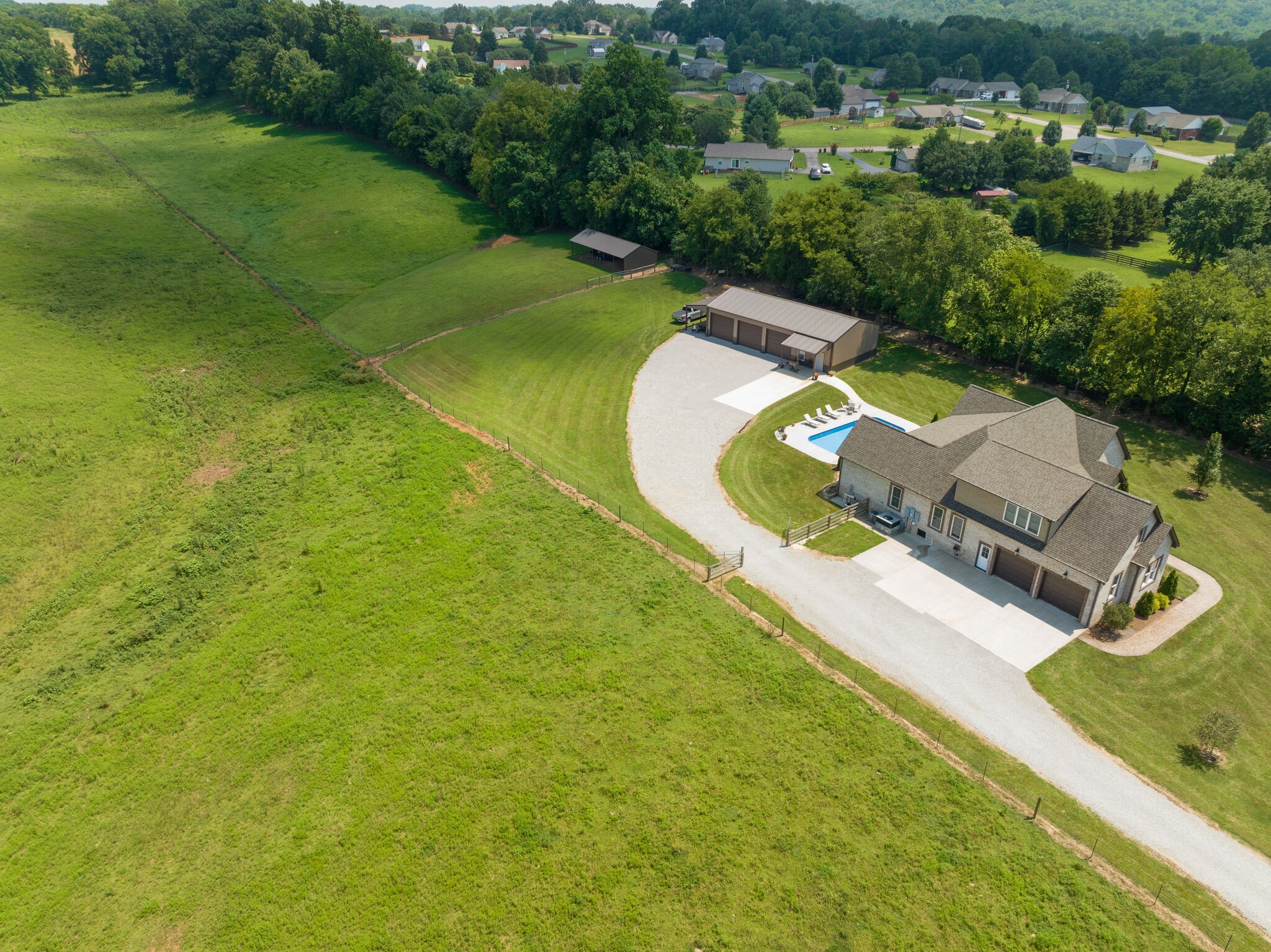 3165 Les Chappell Road Spring Hill, TN 37174 - Photo 66 of 70 an aerial view of a house with a garden and swimming pool