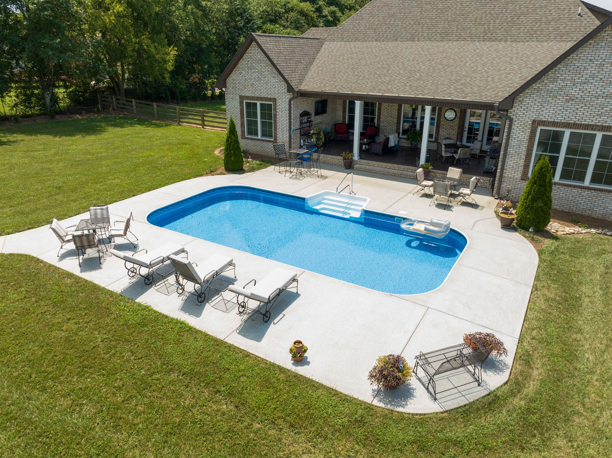 3165 Les Chappell Road Spring Hill, TN 37174 - Photo 67 of 70 a view of a house with swimming pool and sitting area