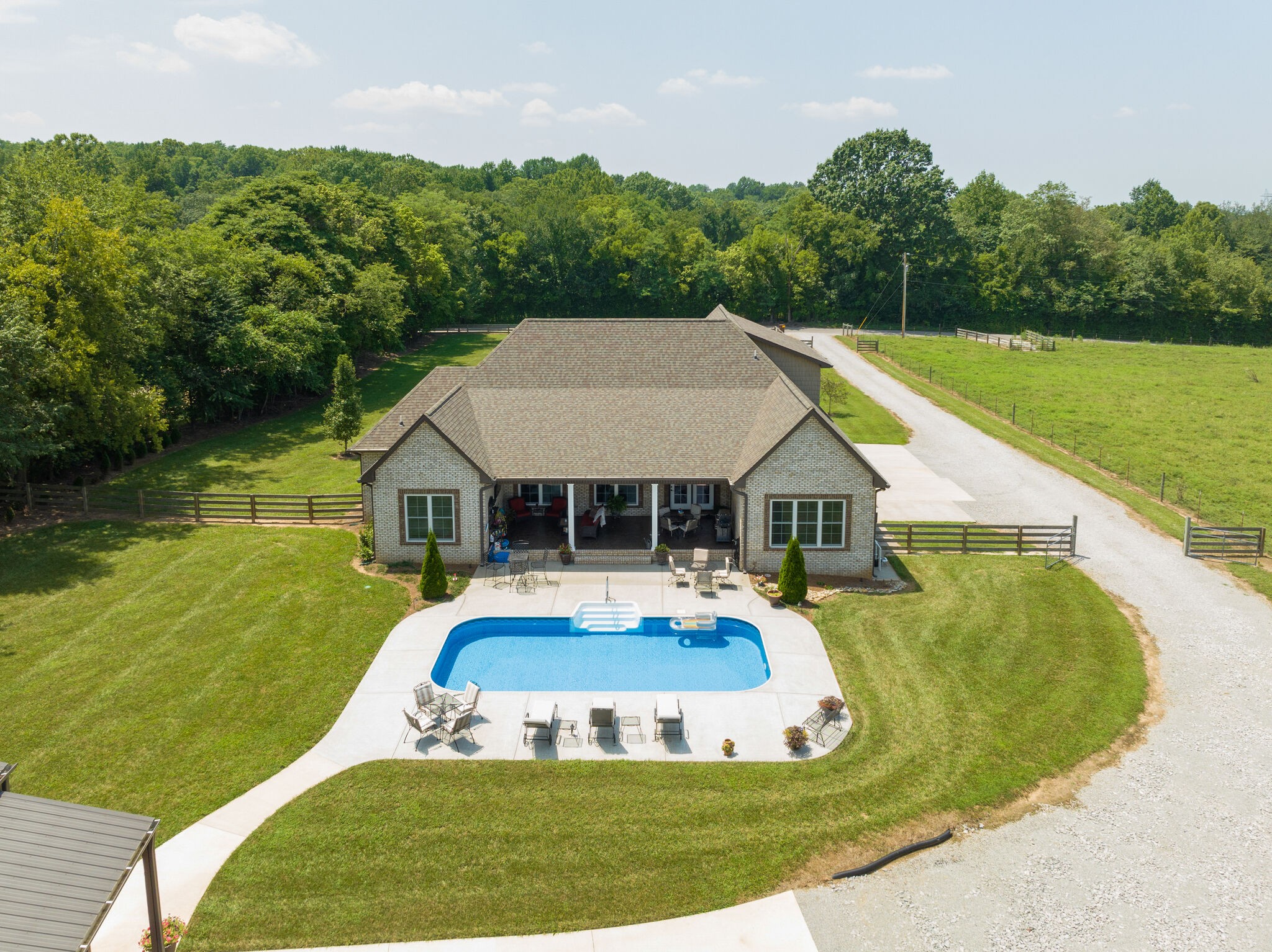 3165 Les Chappell Road Spring Hill, TN 37174 - Photo 68 of 70 a view of a house with pool and a garden