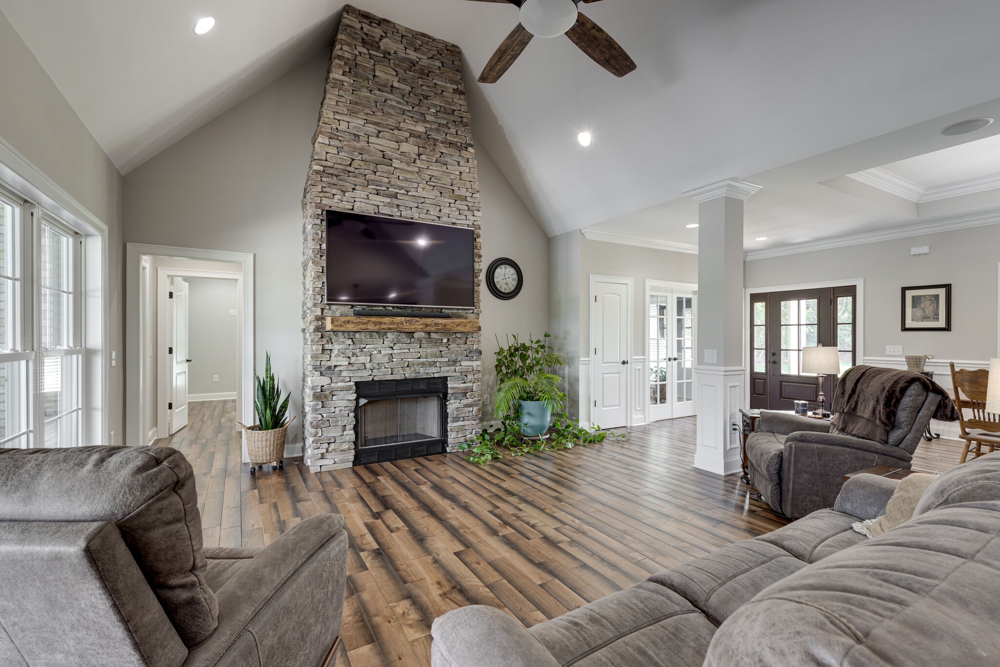 3165 Les Chappell Road Spring Hill, TN 37174 - Photo 7 of 70 a living room with furniture a fireplace a flat screen tv and a fireplace