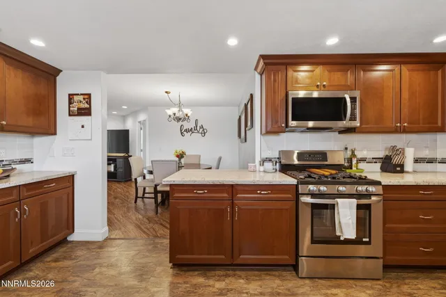 a kitchen with a stove and a sink