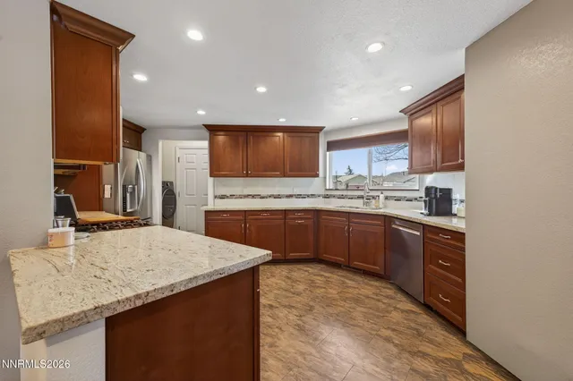a kitchen with a sink stove and refrigerator