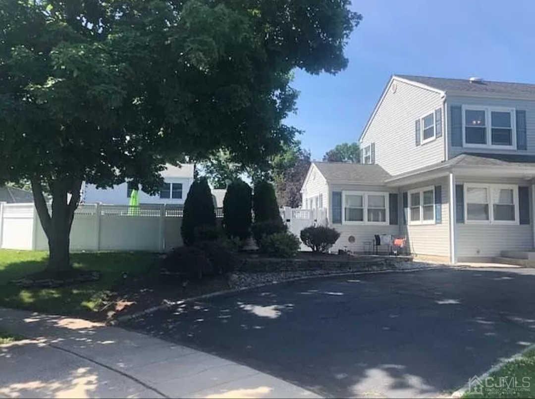 11 Rose Place Middlesex, NJ 08846 - Photo 2 of 4 a front view of a house with a yard