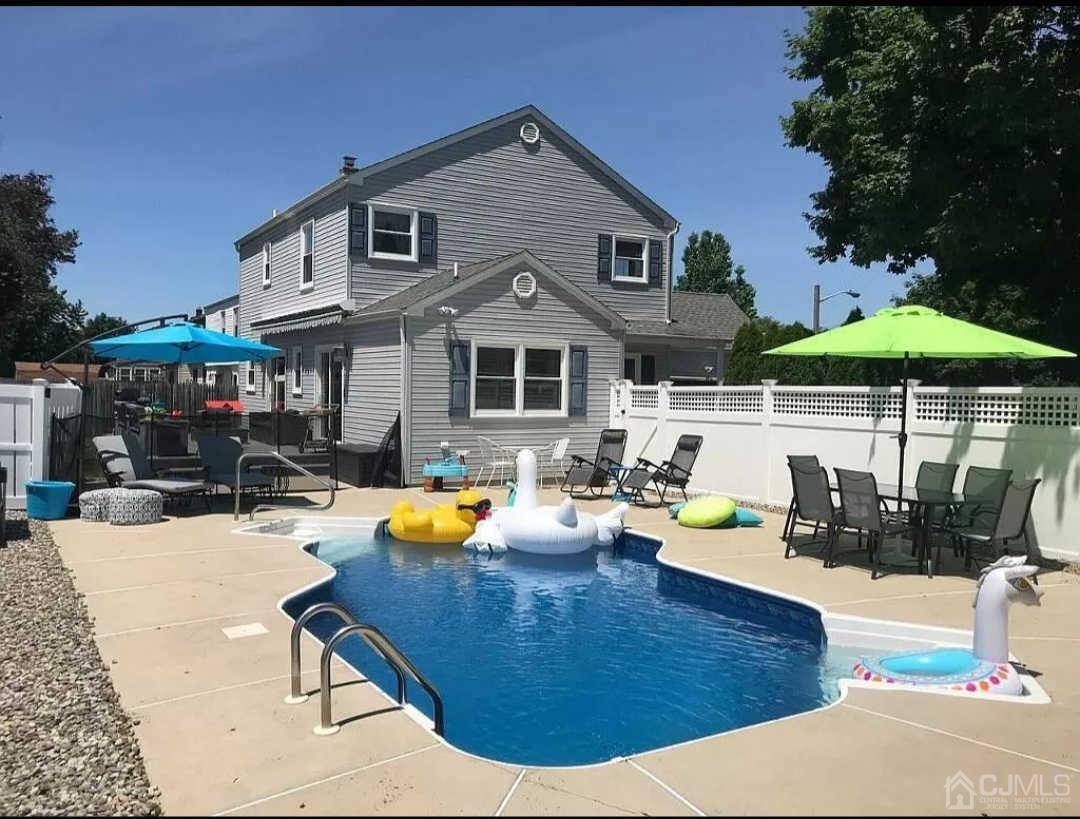 11 Rose Place Middlesex, NJ 08846 - Photo 4 of 4 a view of a house with sitting area and furniture