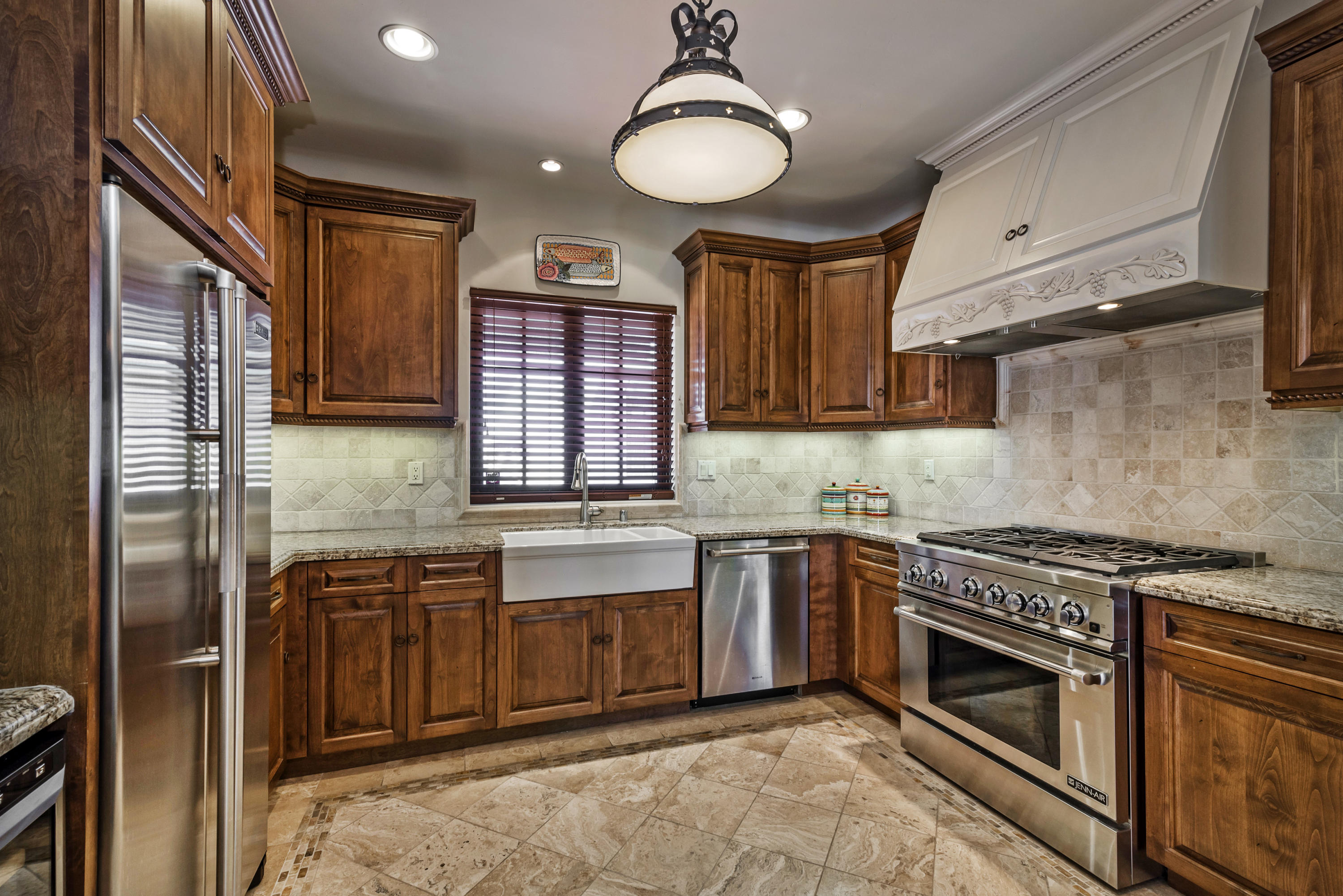 4004 Via Lucero, Unit 7 Santa Barbara, CA 93110 - Photo 1 of 14 a kitchen with stainless steel appliances granite countertop a stove sink and cabinets