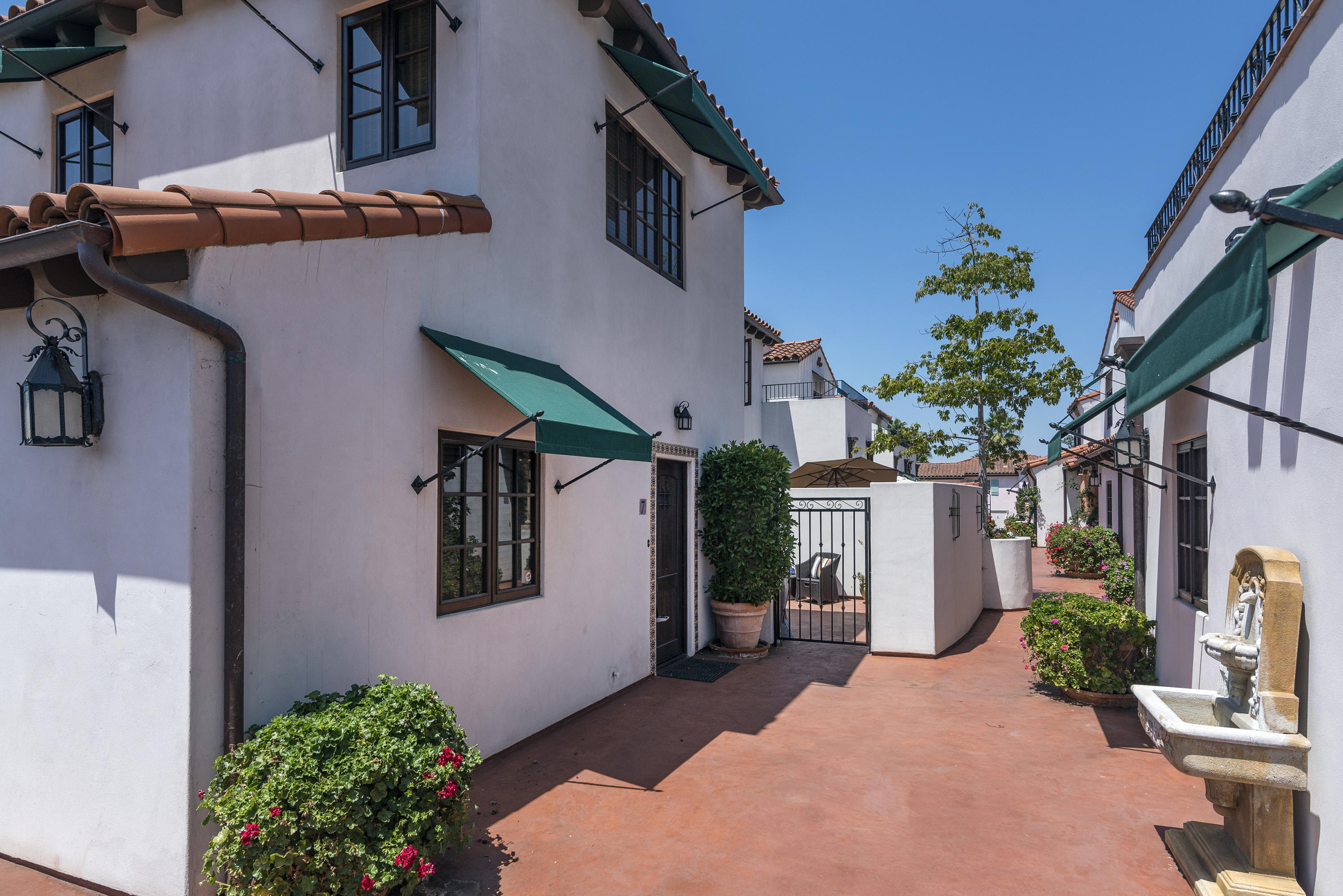 4004 Via Lucero, Unit 7 Santa Barbara, CA 93110 - Photo 12 of 14 a front view of a house with a yard