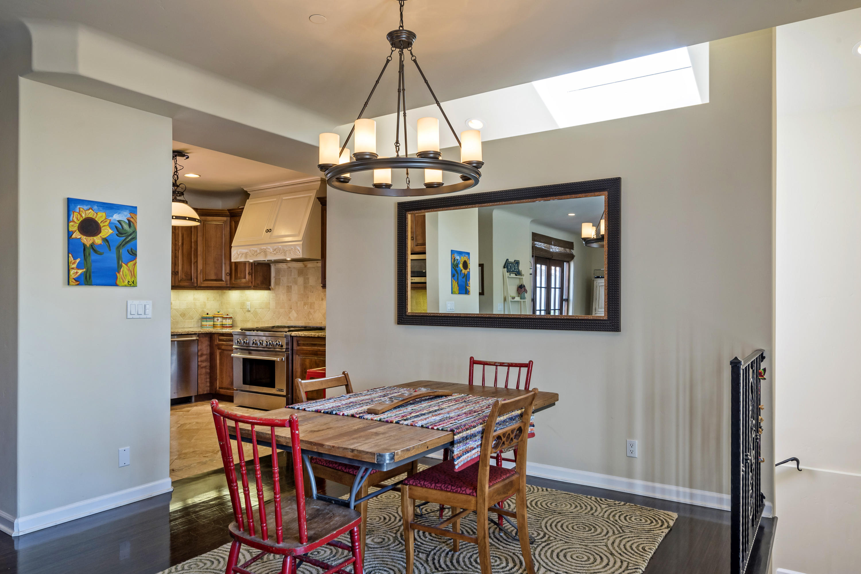 4004 Via Lucero, Unit 7 Santa Barbara, CA 93110 - Photo 2 of 14 a view of a dining room with furniture and a chandelier
