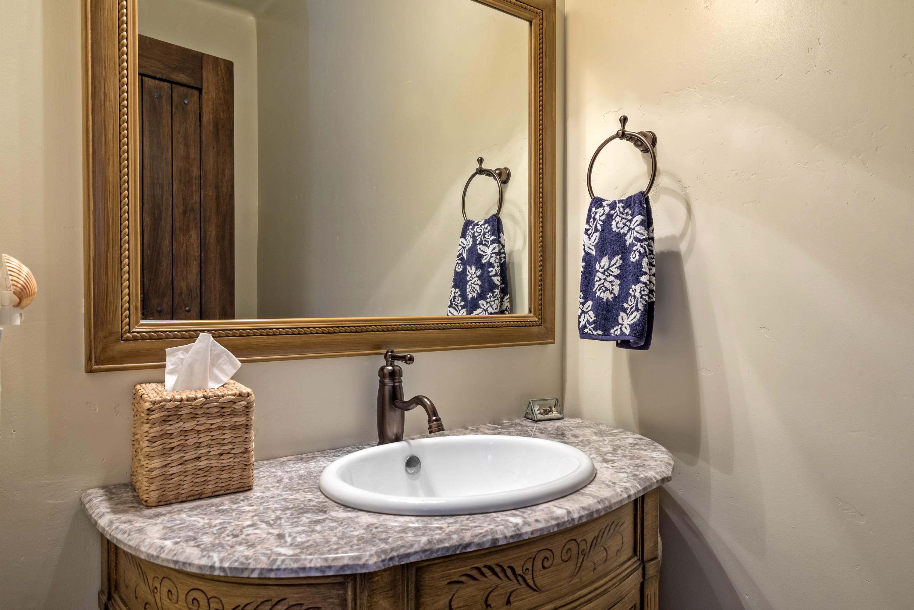 4004 Via Lucero, Unit 7 Santa Barbara, CA 93110 - Photo 5 of 14 a bathroom with a granite countertop sink and a mirror