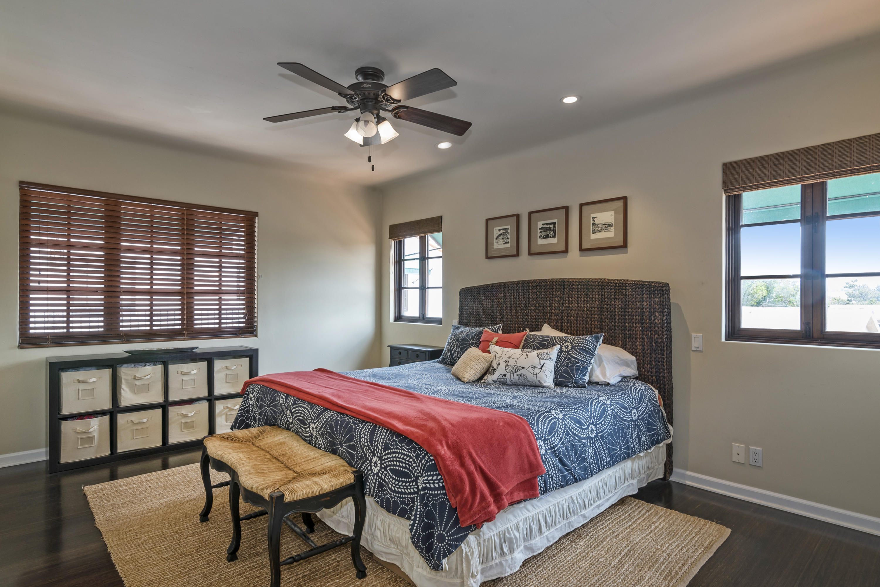 4004 Via Lucero, Unit 7 Santa Barbara, CA 93110 - Photo 6 of 14 a bedroom with a bed and a chandelier
