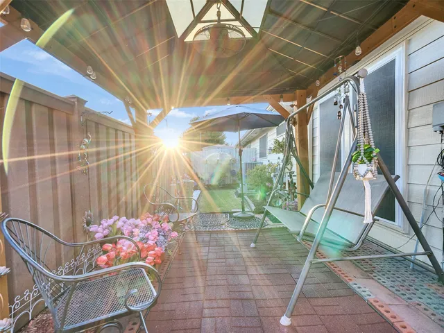 a view of a chairs and table in the patio