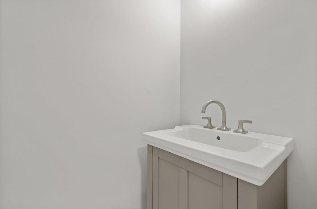 6 Sheffield Road Framingham, MA 01701 - Photo 19 of 32 a bathroom with a sink and a vanity
