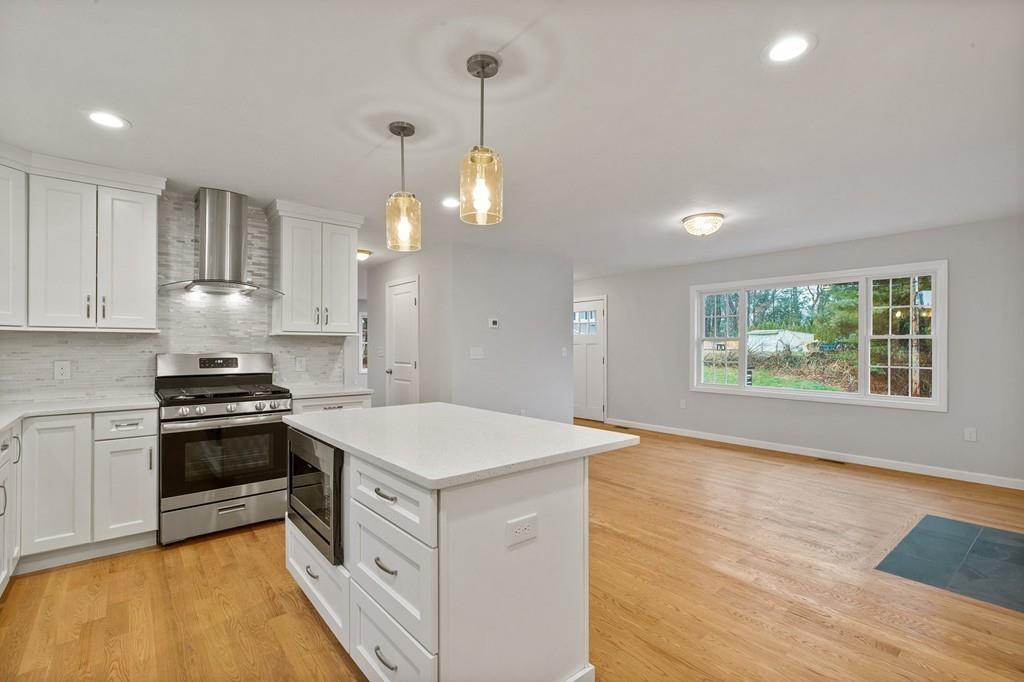 6 Sheffield Road Framingham, MA 01701 - Photo 7 of 32 a kitchen with a stove a sink and a refrigerator