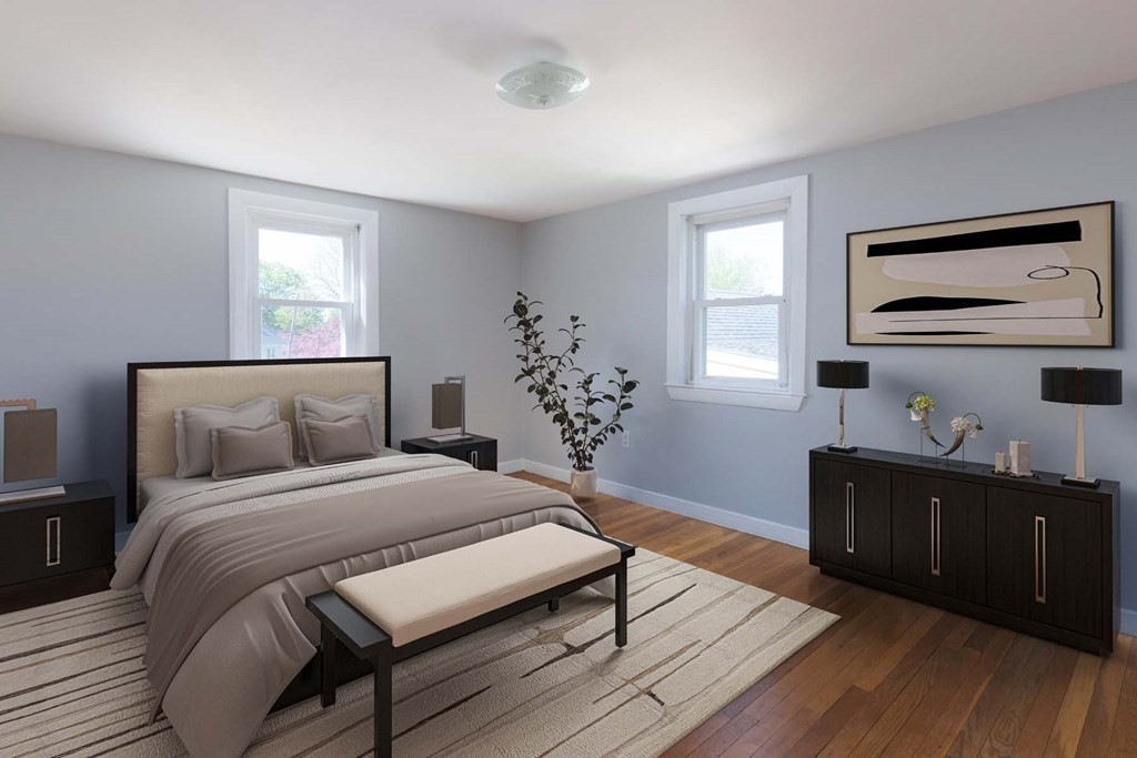 24 Endicott Road Stoneham, MA 02180 - Photo 5 of 15 a bedroom with a bed and wooden floor
