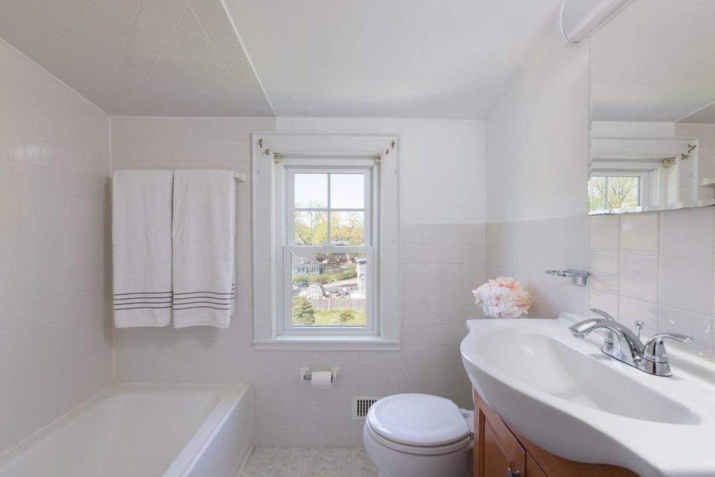 24 Endicott Road Stoneham, MA 02180 - Photo 9 of 15 a bathroom with a sink a toilet and tub