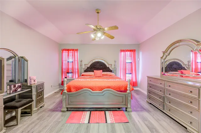 a bedroom with a bed and a dresser