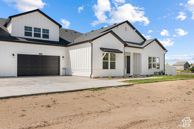 549 North Legend Circle, Unit C/466 Mapleton, UT 84664 - Photo 1 of 39 Modern inspired farmhouse featuring board and batten siding, a shingled roof, concrete driveway, and a garage