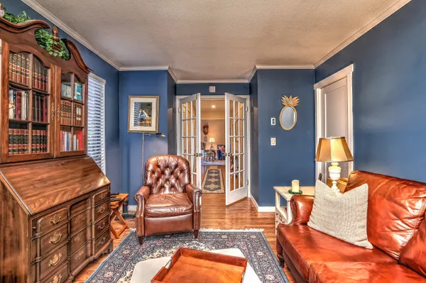 a bedroom with furniture and a window