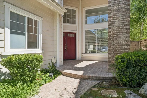 a view of entryway with stairs and wooden floor