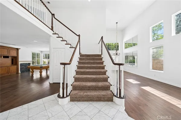 a view of a big room with windows and closet