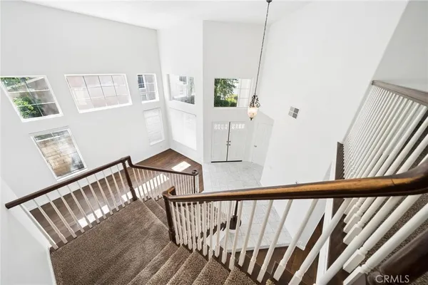 a view of empty room with a windows and ceiling fan