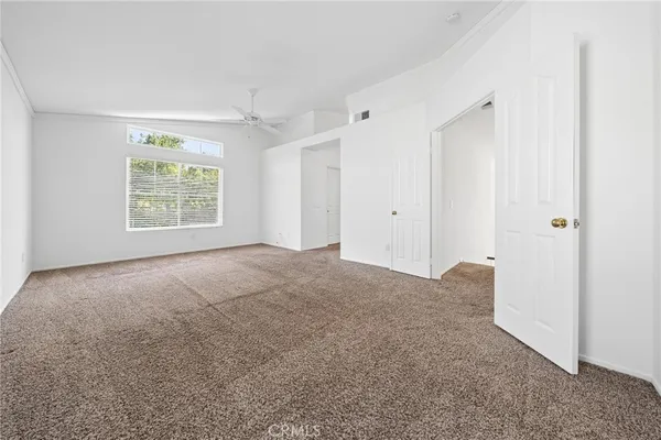 a view of a big room with a kitchen