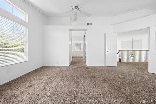 a spacious bathroom with a shower sink and mirror