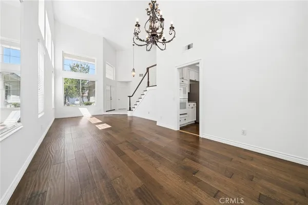a view of entryway with stairs and wooden floor