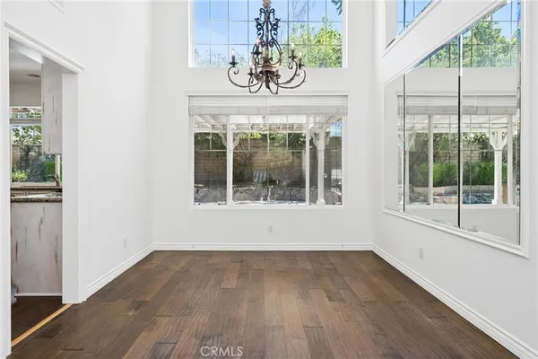 a view of an entryway with wooden floor