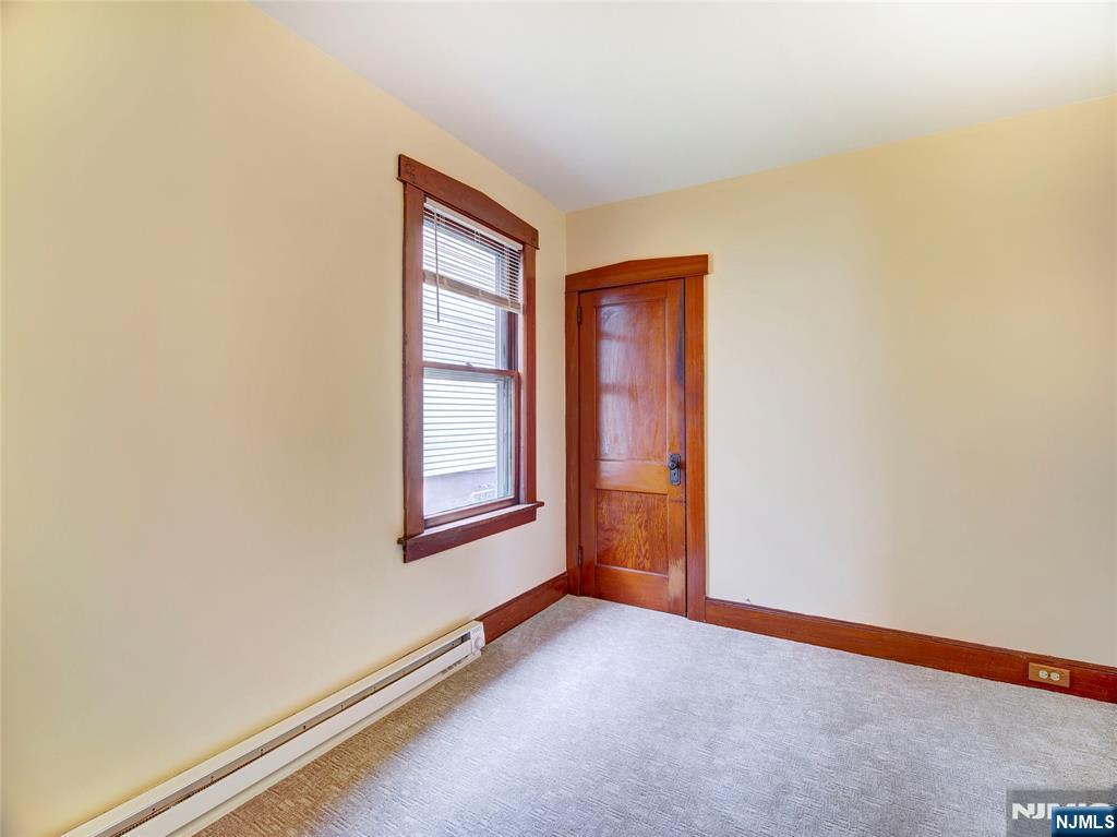 140 Westervelt Avenue Hawthorne, NJ 07506 - Photo 11 of 36 an empty room with windows