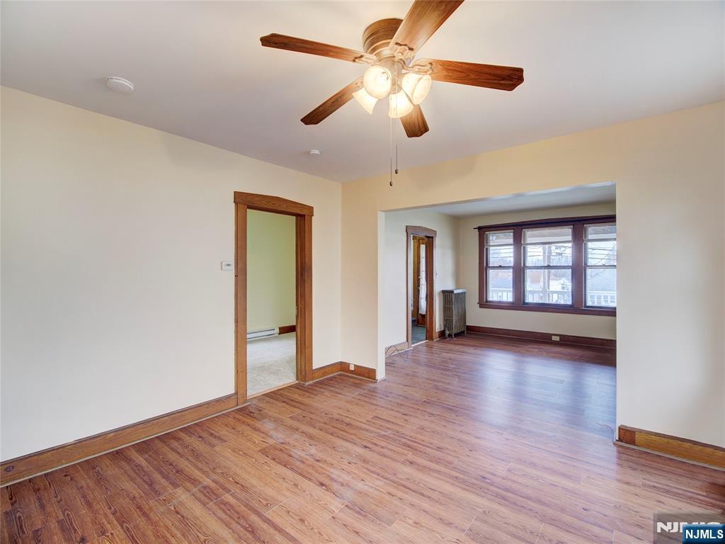 140 Westervelt Avenue Hawthorne, NJ 07506 - Photo 12 of 36 a view of empty room with wooden floor and fan