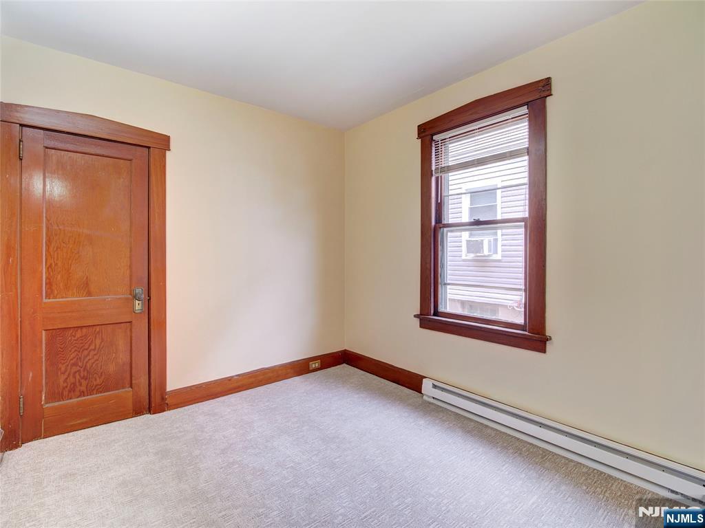 140 Westervelt Avenue Hawthorne, NJ 07506 - Photo 14 of 36 an empty room with windows