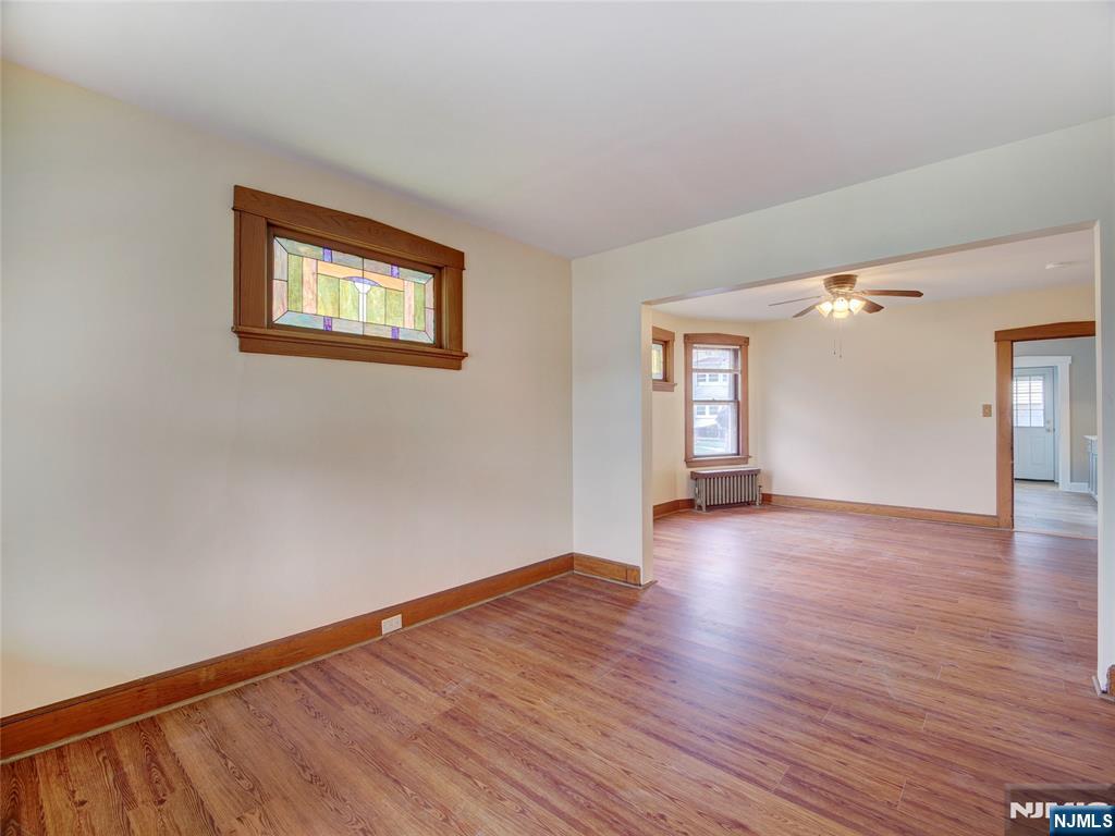 140 Westervelt Avenue Hawthorne, NJ 07506 - Photo 16 of 36 a view of an empty room with window and wooden floor