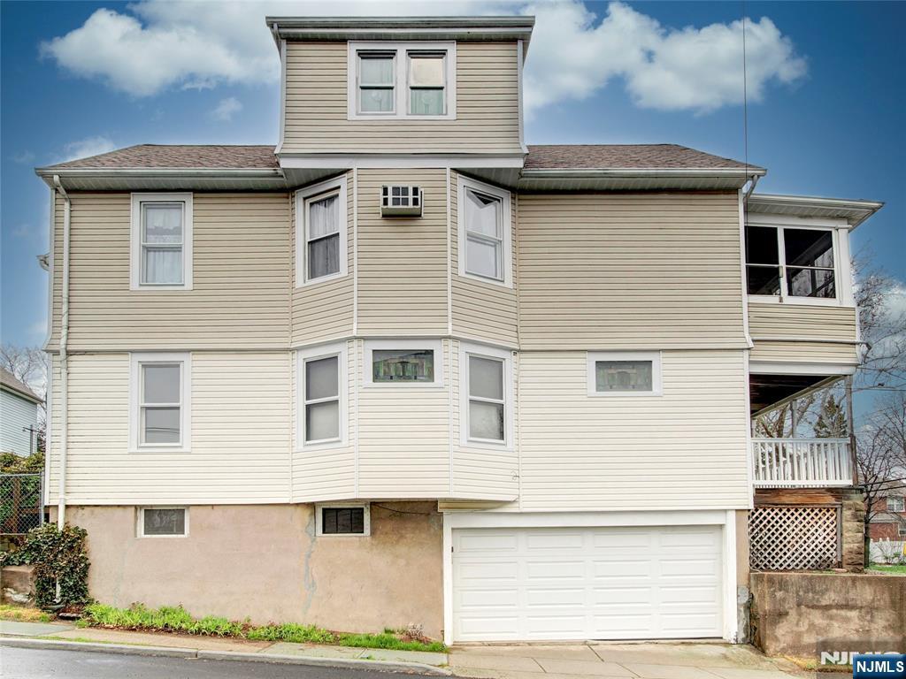 140 Westervelt Avenue Hawthorne, NJ 07506 - Photo 2 of 36 a front view of a house