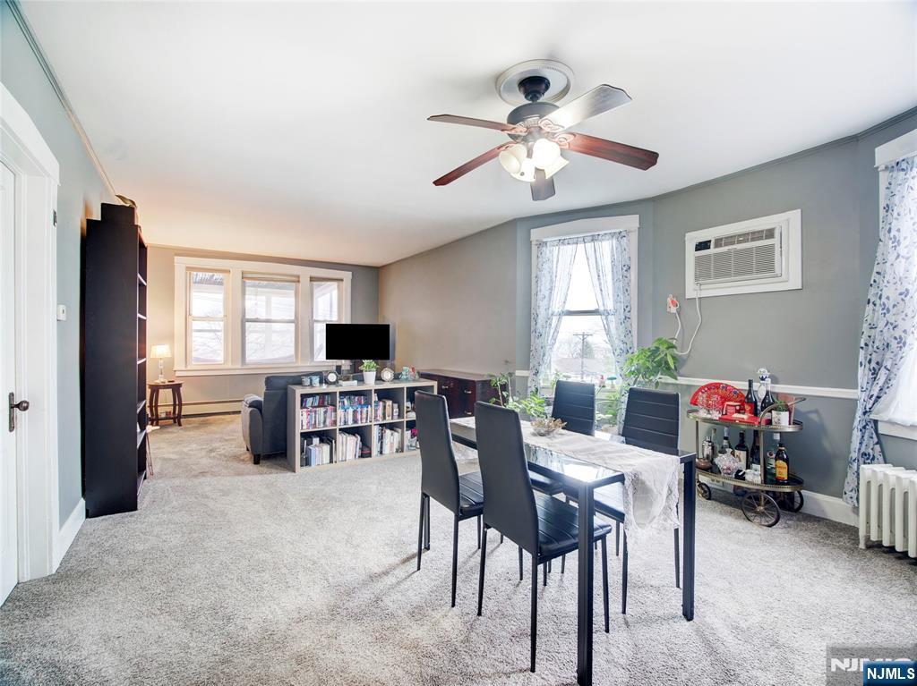 140 Westervelt Avenue Hawthorne, NJ 07506 - Photo 25 of 36 a view of a livingroom and a dining room with furniture window and wooden floor