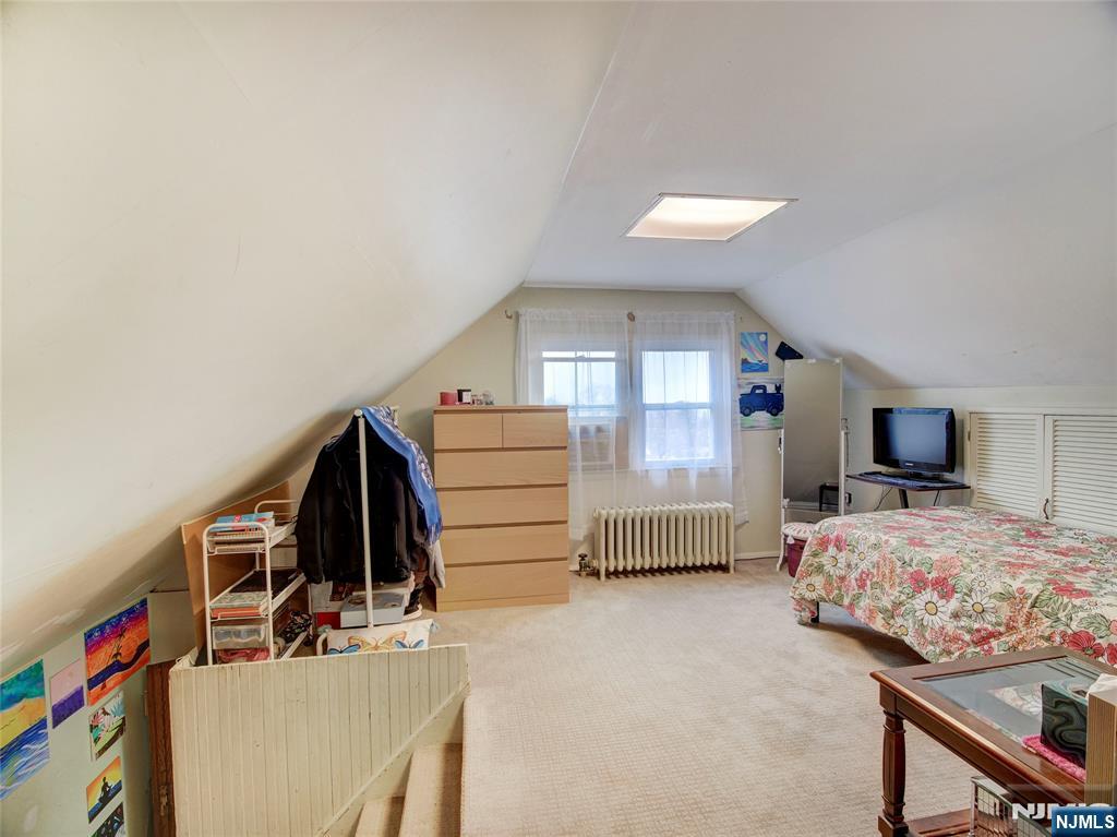 140 Westervelt Avenue Hawthorne, NJ 07506 - Photo 28 of 36 a bedroom with a bed and a closet